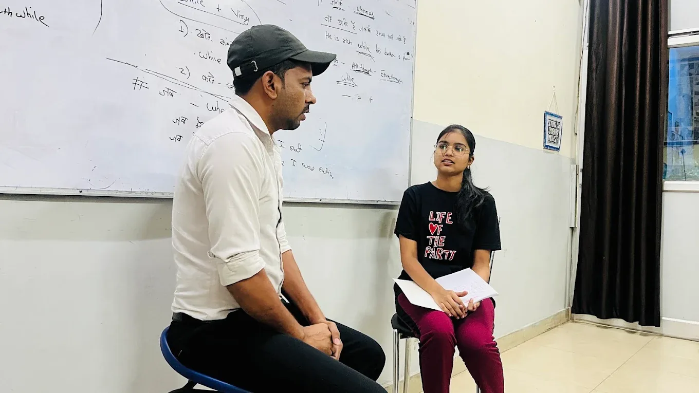 Umesh Sir guiding a learner during speaking practice